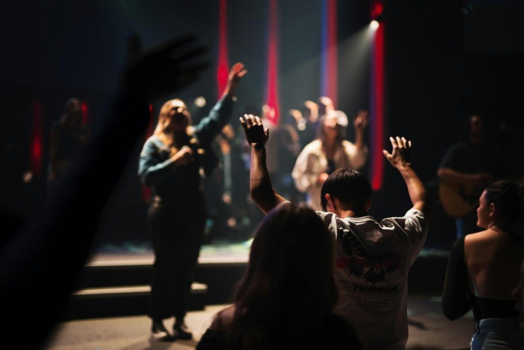 a group of people standing on top of a stage